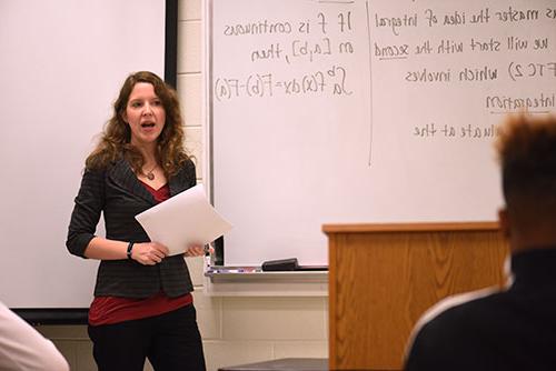 Stacey Erntsberger stands at the front of a classroom to teach