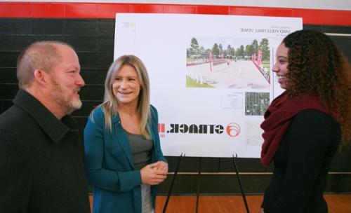 Scott Malone talks with beach volleyball coaches