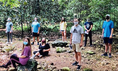 Students stand socially distanced while practicing for the fall Theatre performance