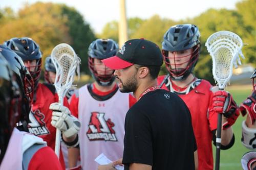 Lacrosse Head Coach talks to team