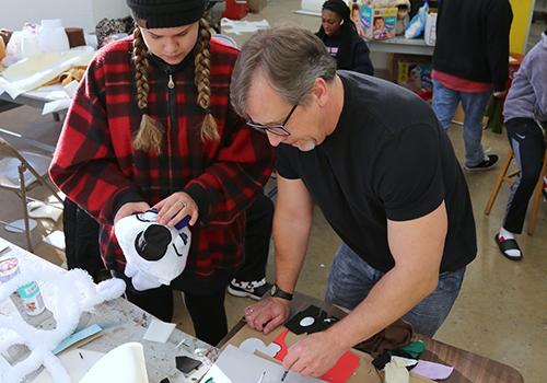 Interim students create puppets with professor's help