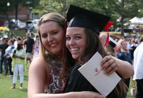 Friends celebrate at a past commencement