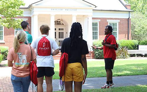 Orientation tour group in front of Quillian Building