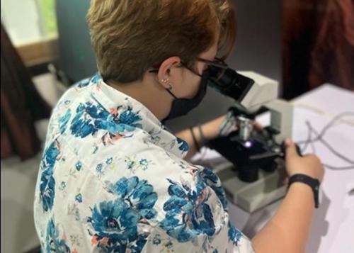 Student at microscope