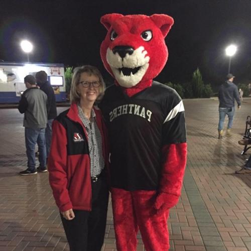 Kathy McCollum poses with Pouncer